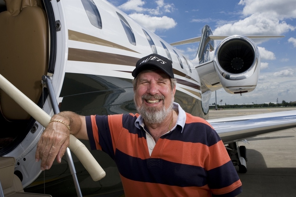 Bill Heinecke, an American who has lived in Asia for most of his life and has taken Thai citizenship poses for a portrait in front of his company jet at Bangkok's second International Airport, Don Muang. Heâs a self-made multi-millionaire who has built a huge chain of retail and food businesses. His company also owns a growing hotel business with all the Four Seasons hotels in Thailand, several Marriotts, and his own Anantara brand.